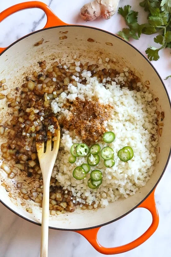 This quick and easy Indian-inspired skillet dish, is a low-carb take on Chicken Biryani, made with riced cauliflower in place of rice. It's also Keto, gluten-free and Whole30 compliant.