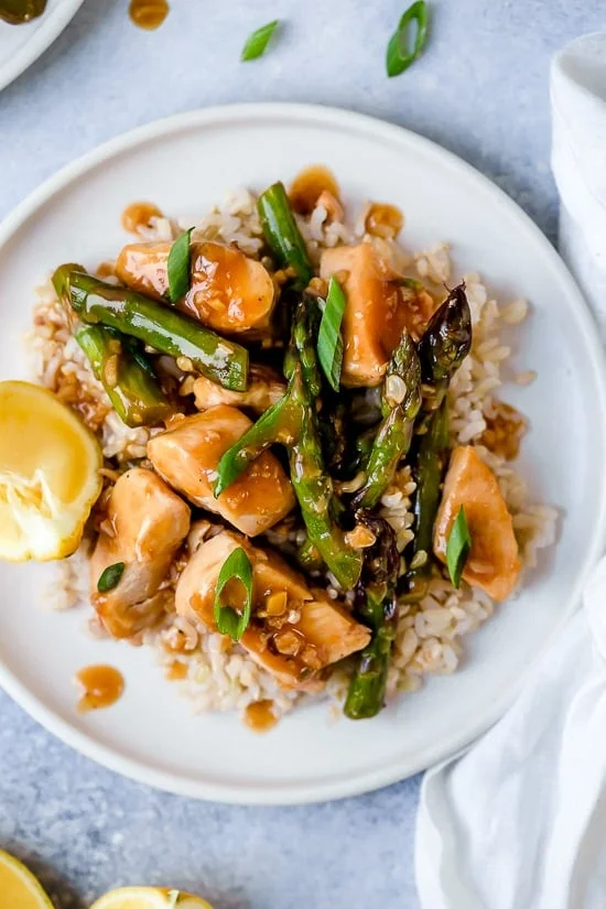 This quick weeknight Chicken and Asparagus Lemon Stir Fry is perfect for spring, made with lean chicken breast, asparagus, fresh lemon, garlic and ginger.