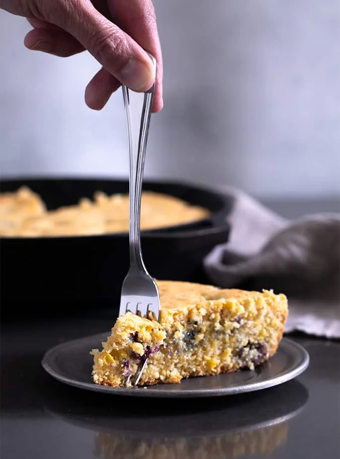 This recipe for gluten free blueberry cornbread is a lightly sweet, naturally dairy-free take on a classic cornbread recipe. It's perfect for potlucks and barbecues, or even for breakfast!