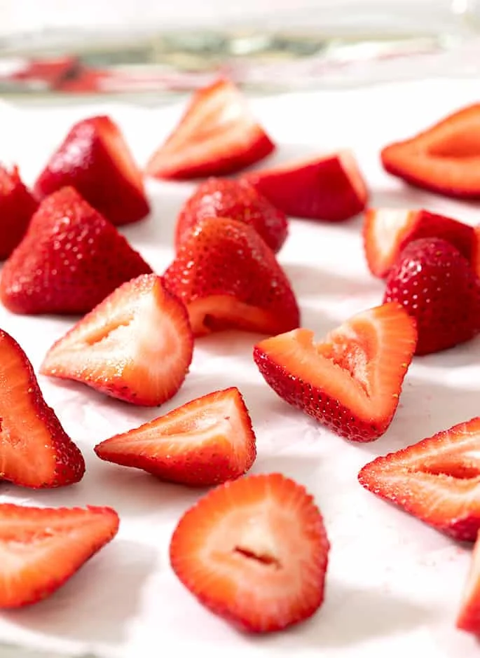 This rich, creamy strawberry ice cream recipe is made without eggs and without an ice cream maker, and with just 3 simple everyday ingredients like these perfect strawberries.
