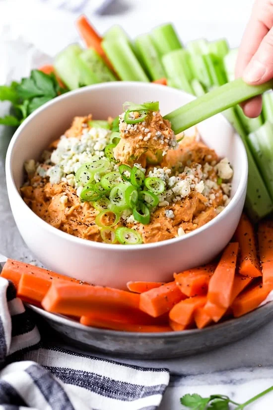 This Slow Cooker Buffalo Chicken Dip has everything you love about buffalo wings, only made into a dip – no messy hands!