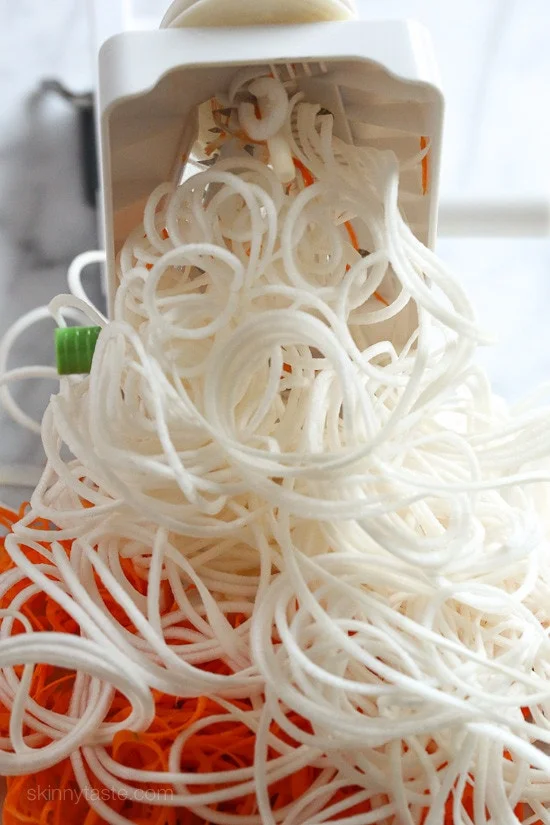 This spiralized turnip, carrot and potato au gratin casserole is baked with turkey in a light cream sauce finished with grated Gruyere cheese – a dish worthy for your Holiday table.