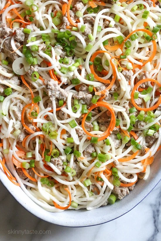 This spiralized turnip, carrot and potato au gratin casserole is baked with turkey in a light cream sauce finished with grated Gruyere cheese – a dish worthy for your Holiday table.