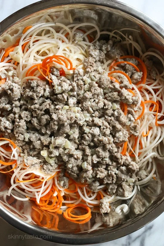 This spiralized turnip, carrot and potato au gratin casserole is baked with turkey in a light cream sauce finished with grated Gruyere cheese – a dish worthy for your Holiday table.