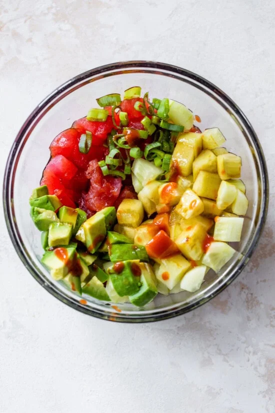 tuna, scallions, cucumber, avocado in a bowl