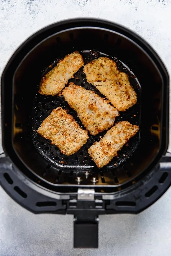 Tzatziki Fish Tacos have a Greek twist! Made with breaded white fish filet topped with mint tzatziki sauce.