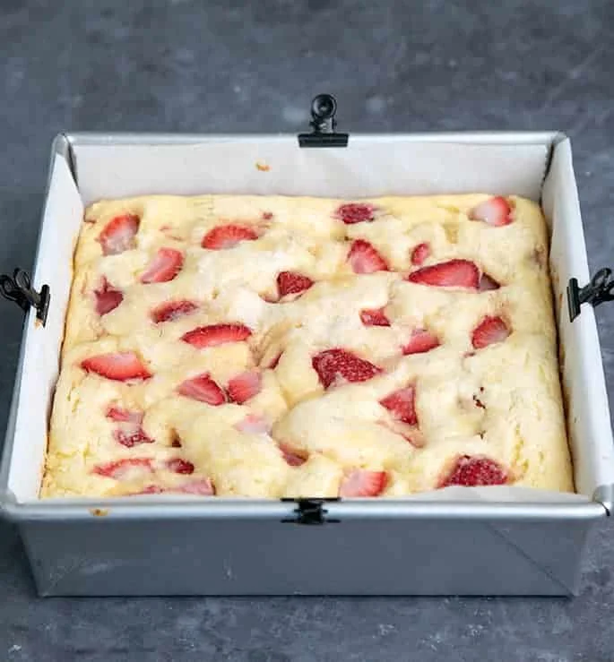 Whole baked strawberry breakfast cake in square pan