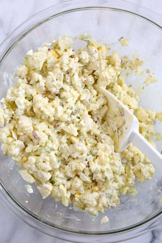 A low-carb faux "potato" salad made with cauliflower instead of potatoes, perfect for Keto or if you're just looking to eat less carbs.
