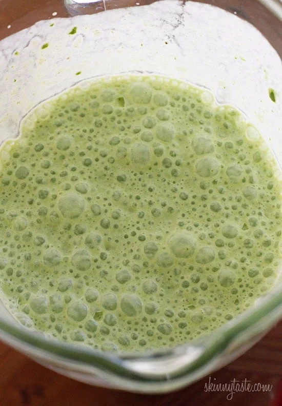 A skinny tropical green smoothie made with pineapple, shredded coconut and bananas, then blended with spinach, light coconut milk and Greek yogurt. High in Vitamin A, B-6, C, Manganese and fiber.
