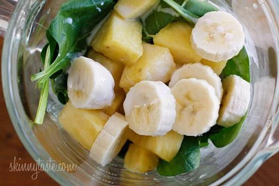 A skinny tropical green smoothie made with pineapple, shredded coconut and bananas, then blended with spinach, light coconut milk and Greek yogurt. High in Vitamin A, B-6, C, Manganese and fiber.