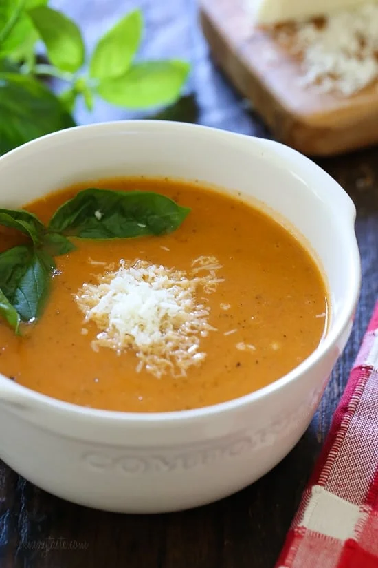 Angled view of a bowl of creamy tomato soup