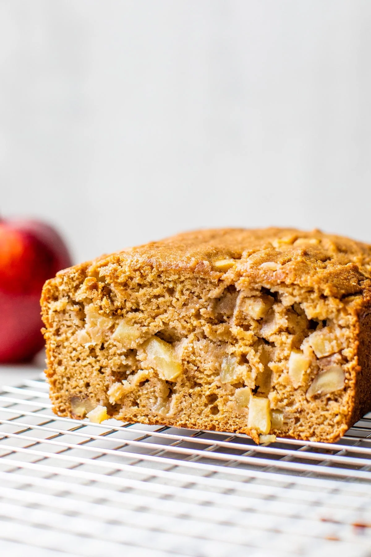 Apple bread on a wire rack.