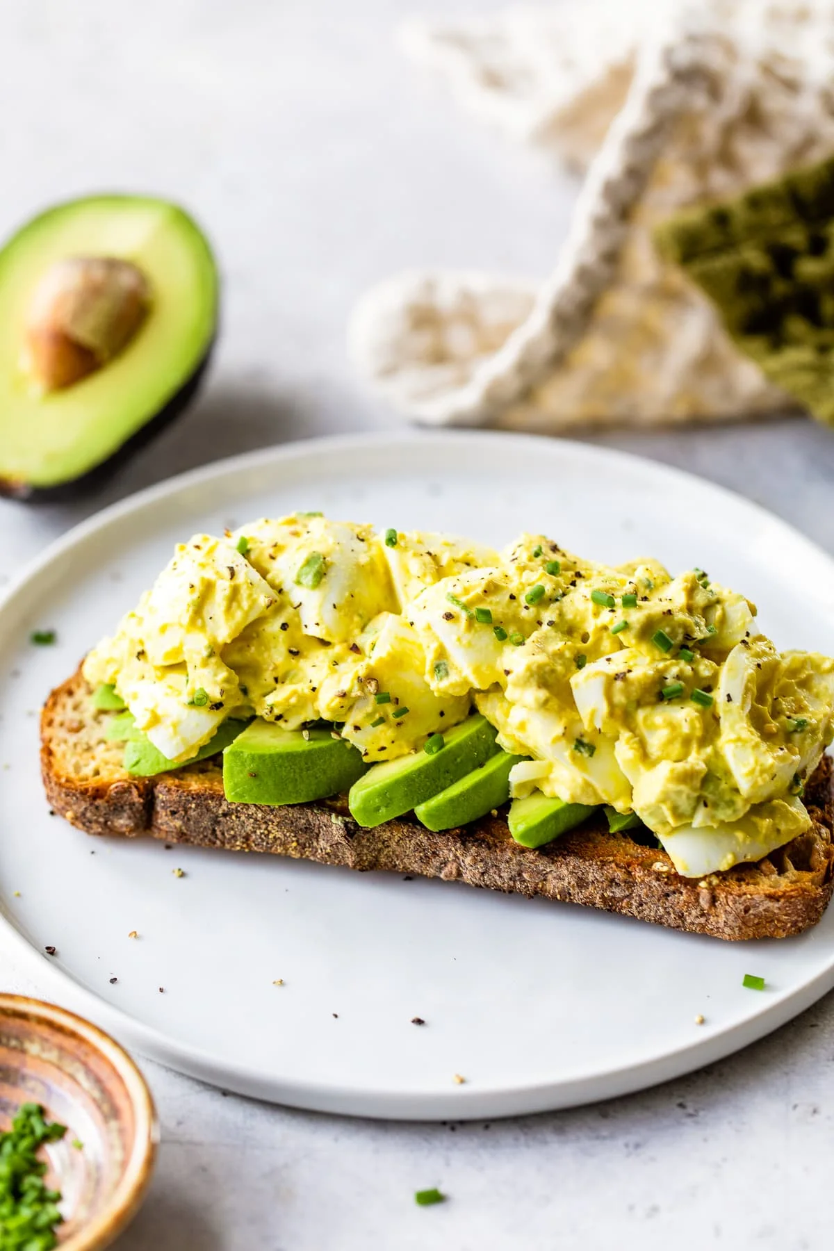 Avocado Egg Salad on a piece of toast.
