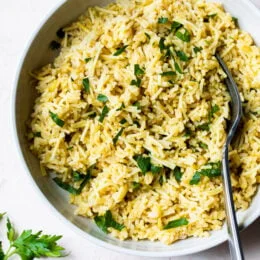 Bowl of rice pilaf with fork.