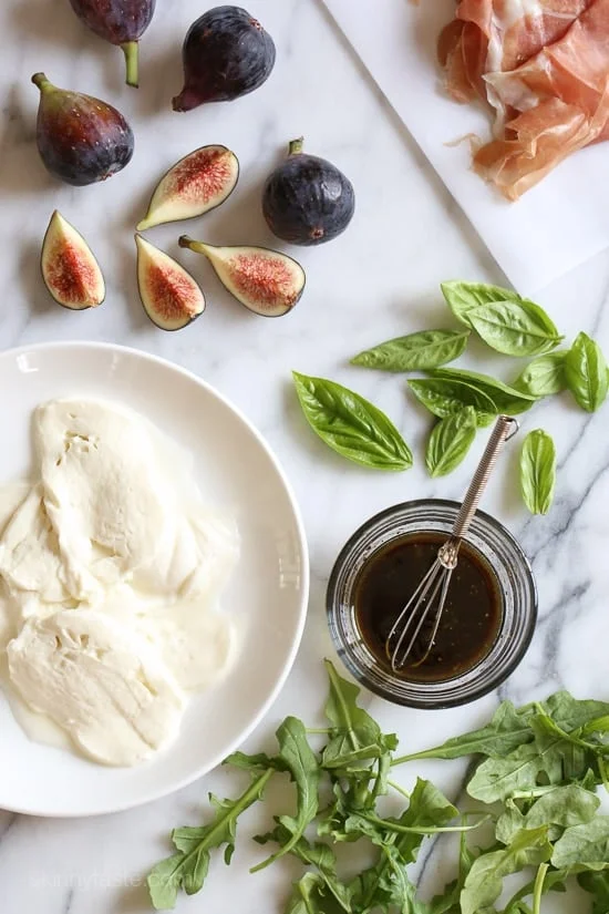 Figs and Prosciutto, savory and sweet they're a match made in heaven! Add some fresh mozzarella, peppery arugula and balsamic dressing and this salad will make you swoon with every bite.