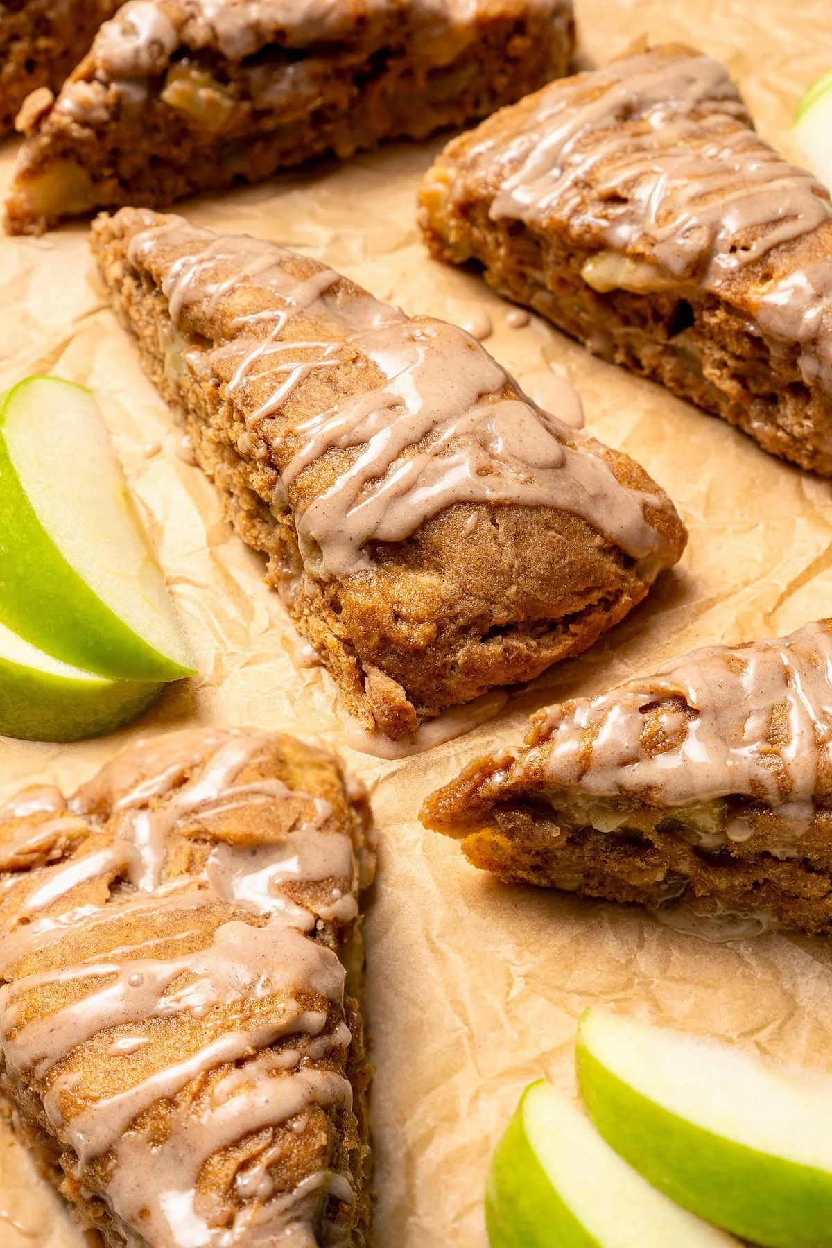 Glazed apple scones set on parchment paper