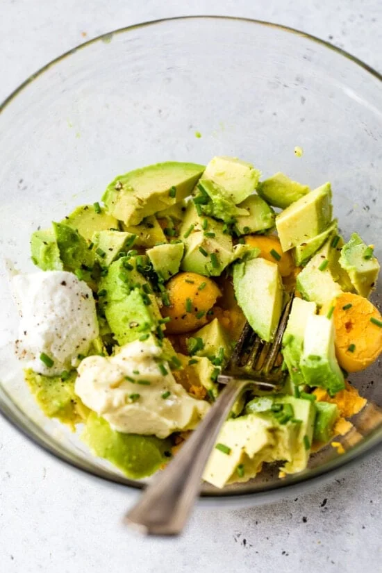 hard boiled eggs and avocado in a bowl.
