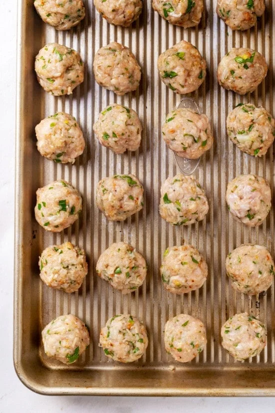 Mini turkey meatballs on a baking sheet