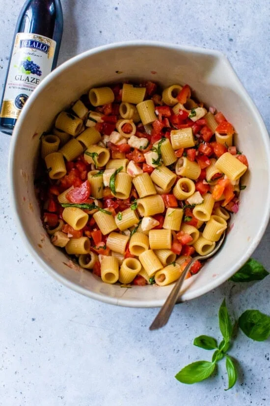 Mix pasta together in a bowl.