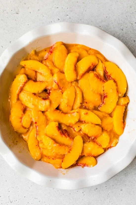 peaches in a pie dish