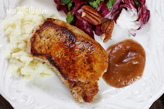Pork loin chops, seasoned with paprika, sage, thyme and spices then lightly pan fried and served with homemade applesauce.