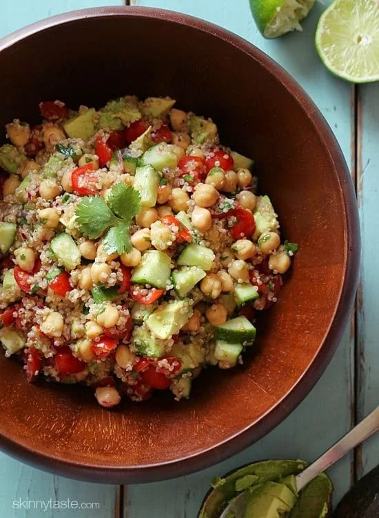 Quinoa chickpea and avocado salad with cucumbers, tomatoes, red onion, lime juice and cilantro – a flavorful vegetarian salad loaded with protein, fiber and healthy fats.