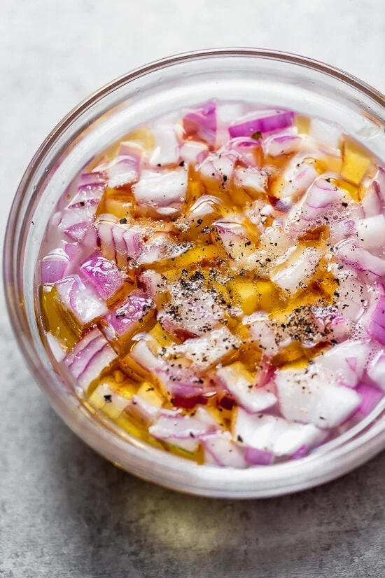 Soad red onion in lime juice and salt to mellow the flavor.
