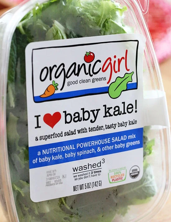 Strawberry salad made with mixed greens, kale and spinach, sliced almonds, crumbled gorgonzola cheese and topped with poppy seed dressing – perfect for summer!