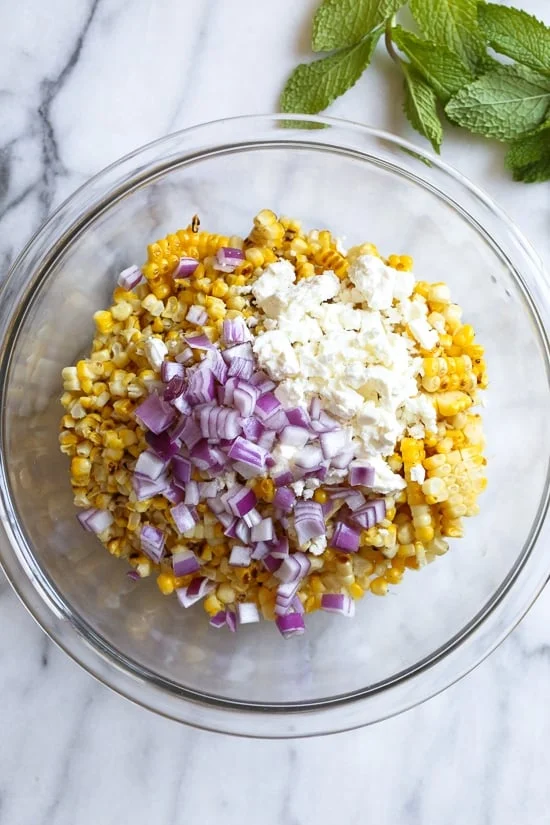 This charred Grilled Corn and Feta Salad is an easy 5-ingredient summer side dish. It goes perfect with anything you're grilling!