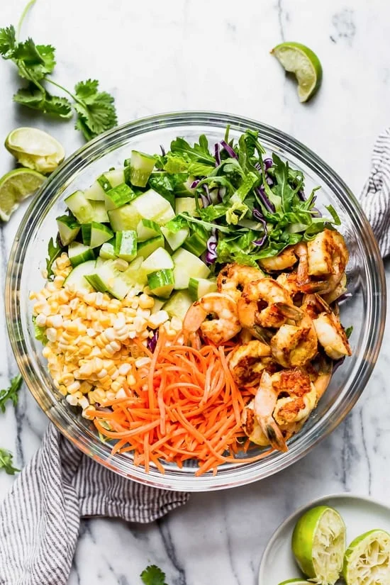 This refreshing Thai-style salad with greens, herbs, veggies and shrimp, all tossed in a delicious cashew dressing, is the perfect one-dish summer dinner.
